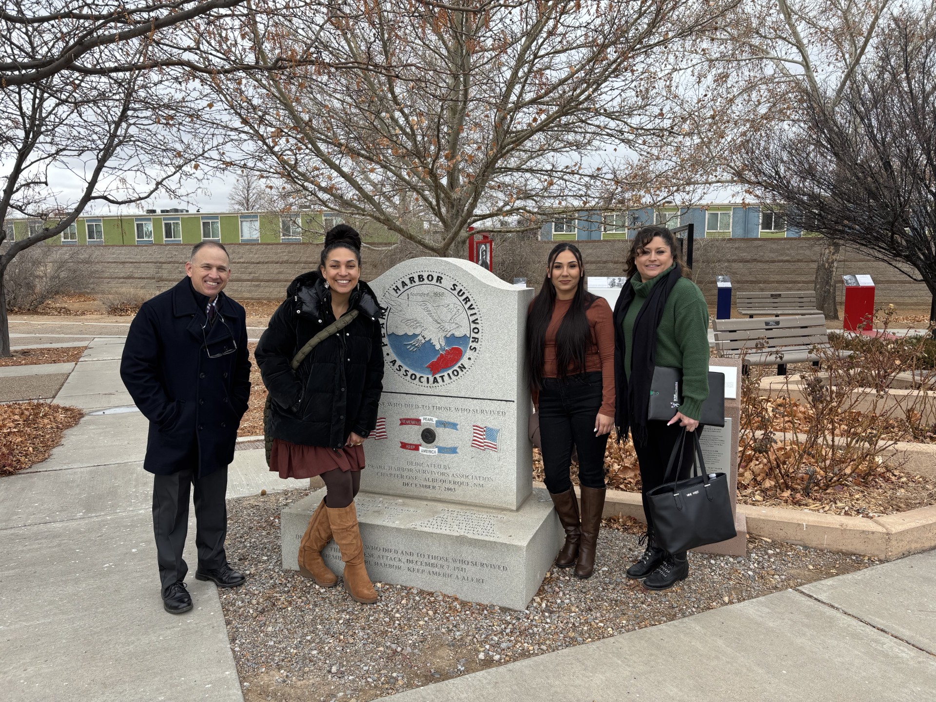 veteran services staff standing together and posing for a picture at the Veterans Memorial